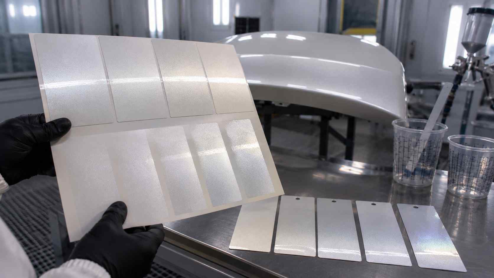 Pearl Effect Layer Control Technician controlling the pearl effect layer on a vehicle panel during paint repair in Dubai