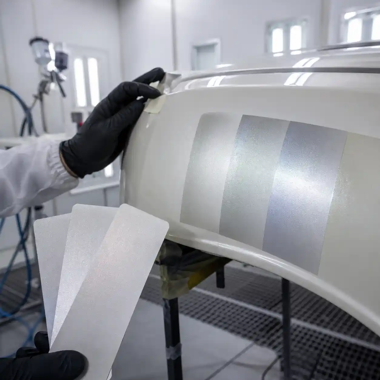 Pearl Paint Repair Dubai Colour Matching Pearl paint colour matching assessment on a vehicle panel in a professional Dubai body shop