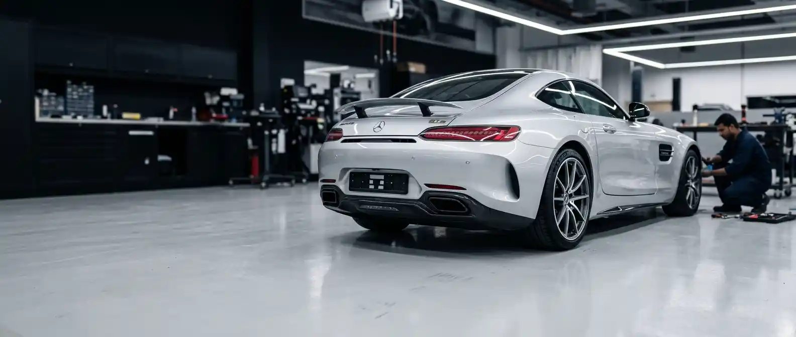 Mercedes-AMG GT undergoing measured body repair assessment in a professional Dubai workshop