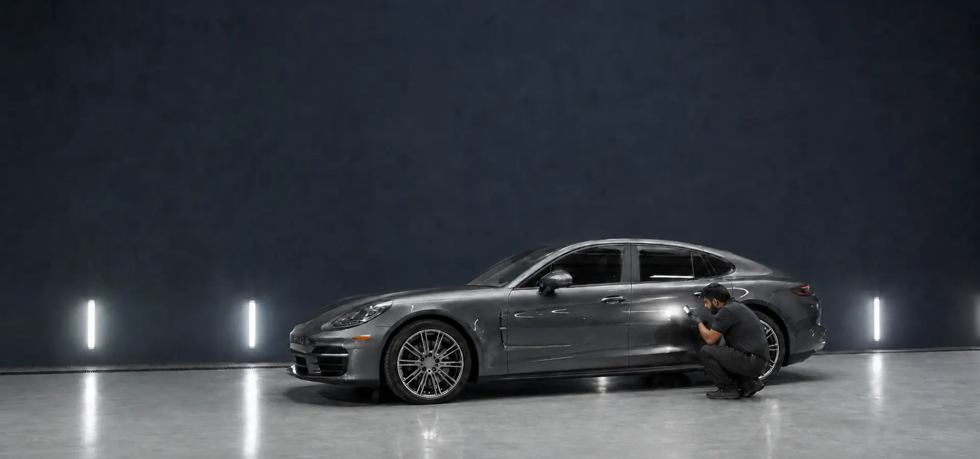 Porsche Panamera undergoing body repair assessment in a professional Dubai workshop